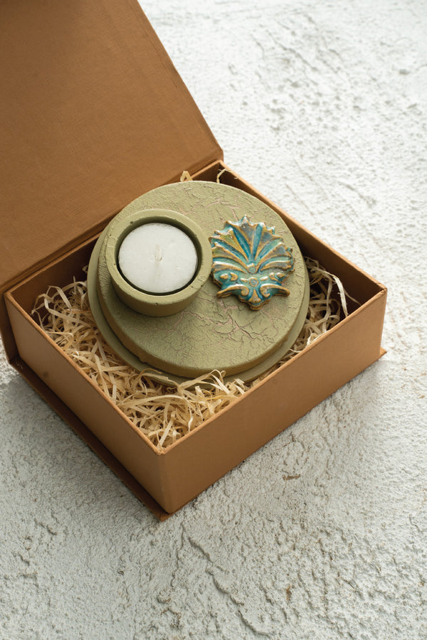 Ceramic motif mounted on canvas with a mdf base.